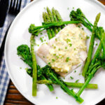 Overhead poached smoked haddock with sauce gribiche, asparagus and tenderstem broccoli.