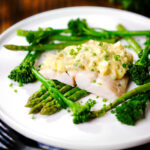 Poached smoked haddock with sauce gribiche, asparagus and tenderstem broccoli.