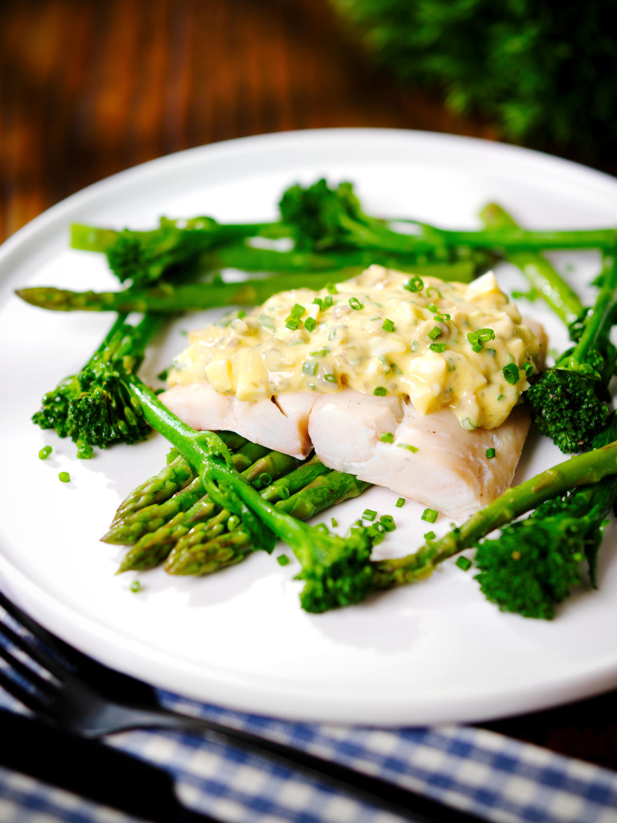 Poached smoked haddock with sauce gribiche, asparagus and tenderstem broccoli.