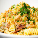 Close-up smoked mackerel pasta (fusilli) with chilli and a lemon crumb.