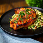 Baked harissa and honey glazed pork chops served with tabbouleh.