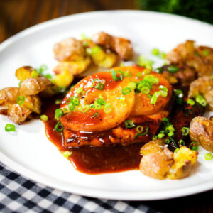 Baked Hawaiian (huli huli) chicken breast with pineapple and crushed new potatoes.