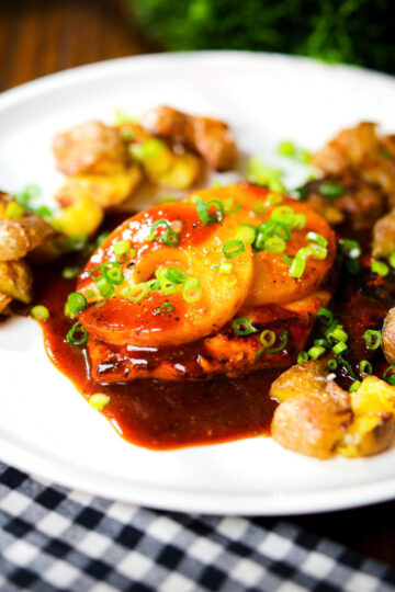 Baked Hawaiian chicken breast with pineapple huli huli sauce and crushed new potatoes.