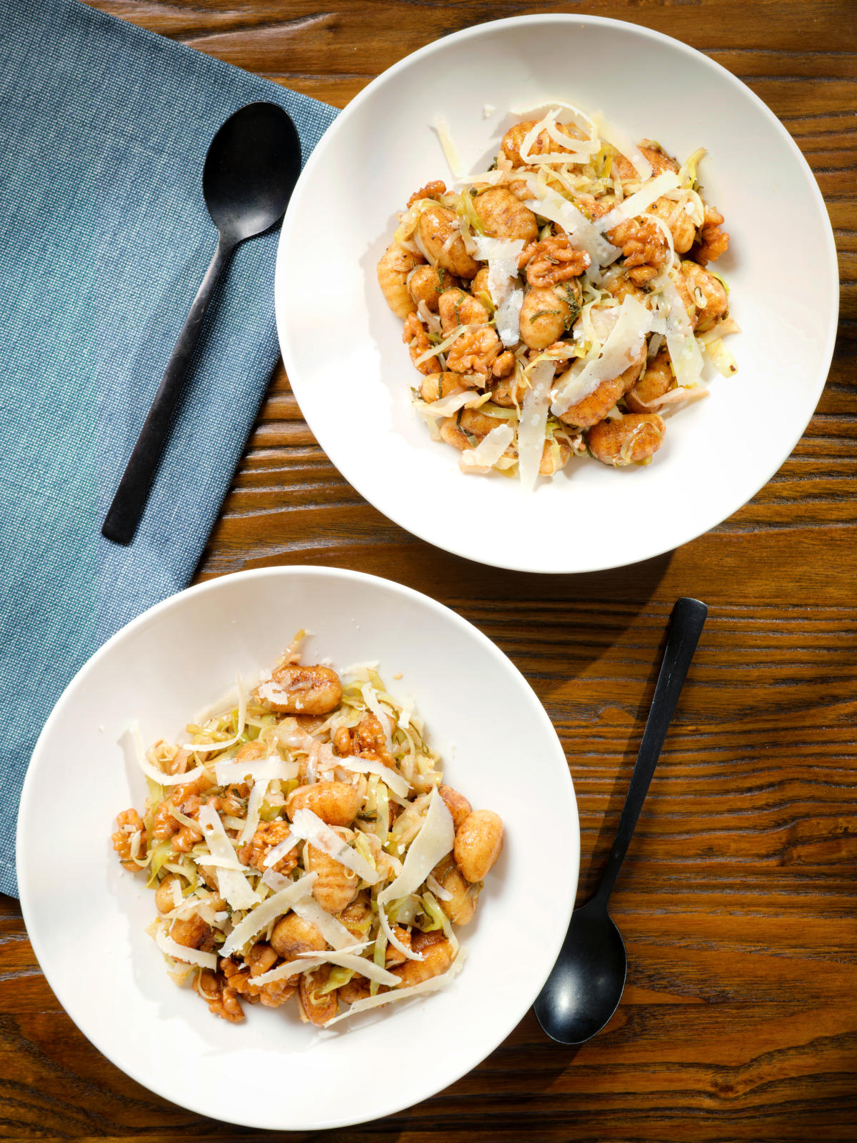 Overhead pan fried cabbage and walnut gnocchi with balsamic vinegar.