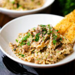 Creamy garlic mushroom pasta served with fresh parsley and garlic bread.