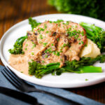 Pork tenderloin medallions with prunes and brandy cream sauce, mashed potato and tenderstem broccoli.