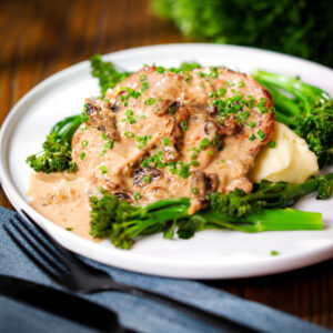 Pork tenderloin medallions with prunes and brandy cream sauce, mashed potato and tenderstem broccoli.