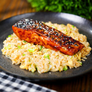Hoisin sauce glazed (grilled) salmon fillet served with egg fried rice.