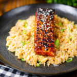 Hoisin sauce glazed salmon fillet served with egg fried rice.