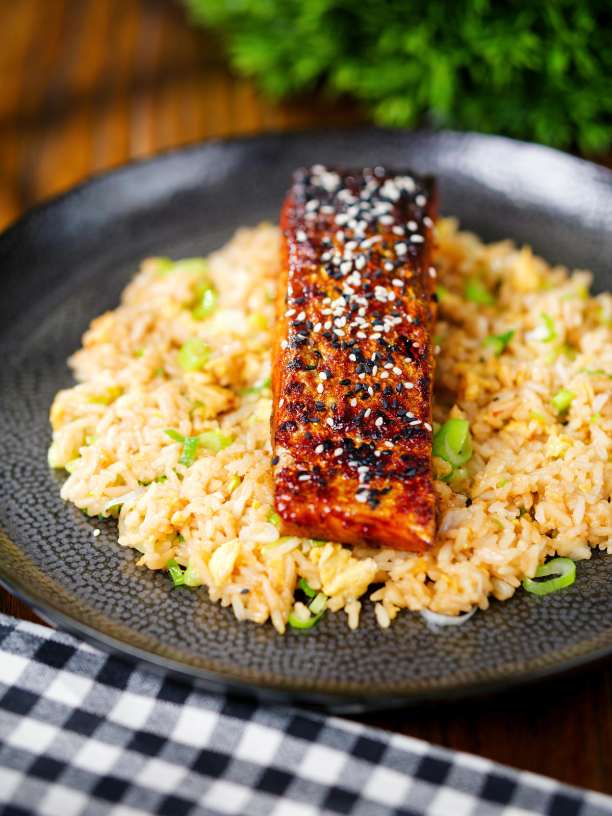 Hoisin sauce glazed salmon fillet served with egg fried rice.