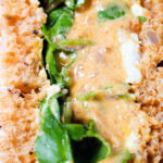 Close-up Coronation chicken sandwich with watercress.