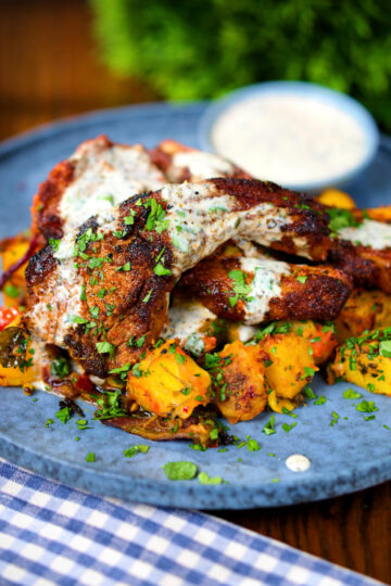 Pan fried Indian masala lamb chops with Bombay potatoes and raita.