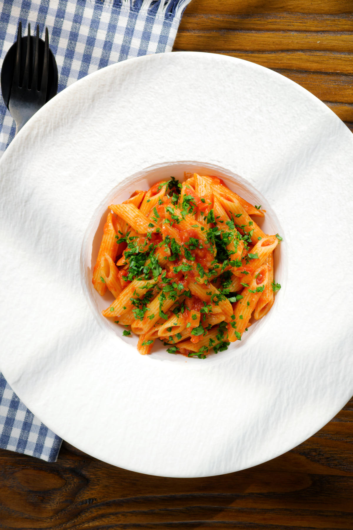Overhead Bloody Mary Pasta (penne alla vodka), served in a white bowl.