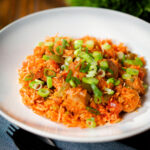 Spicy one-pot sausage and rice with gochujang paste and kimchi.
