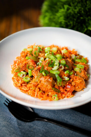 Spicy one-pot sausage and rice with gochujang paste and kimchi.