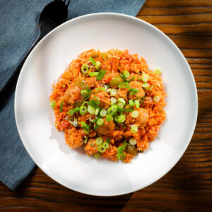 Spicy one-pot sausage and rice with gochujang and kimchi.