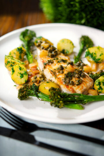 Pan fried halibut with Grenobloise sauce, buttered potatoes and tenderstem broccoli.