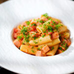 Spam pasta in a tomato and Dijon mustard sauce.